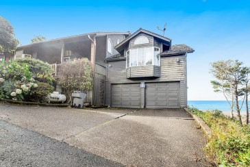 Secluded beachfront home with Pacific Ocean views, fireplace, game room, grill